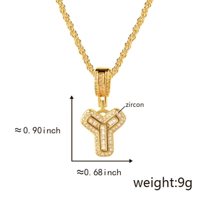Macro detail of gold-plated Y-letter pendant with zircon stones and dimensions
