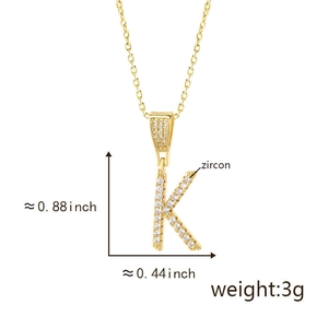 Macro shot of letter K pendant with zircon inlay showing dimensions 0.88 x 0.44 inches
