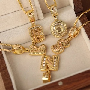 Gold plated letter pendants with cubic zirconia inlay on elegant twist chains