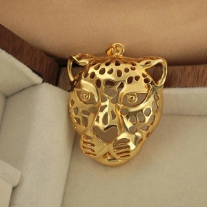 Icy gold-plated hollow leopard head pendant in premium wooden jewelry box display
