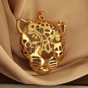 Hollow leopard head pendant in polished gold finish with intricate cut-out details
