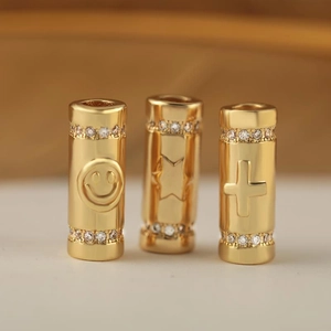 Gold-plated brass pendants with smiley, star, and cross motifs and white zircon accents