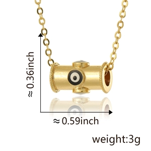 Detail view of evil eye barrel bead charm with dimensions 0.36x0.59 inches in gold finish