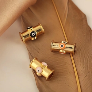 Golden cylinder evil eye beads with colorful enamel and knurled edges for DIY jewelry