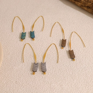 Three pairs of vintage V-shaped arrow drop earrings in multi-colored geometric stones