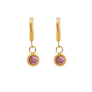 Detail of gold hoop earrings featuring pink marbled stone pendants and textured edges