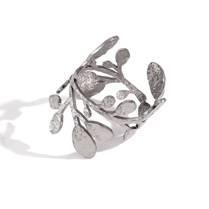 Detailed view of silver open leaf cuff bracelet with olive branch hammered texture