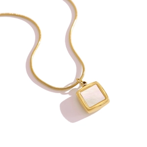 Golden square necklace with white shell inlay and sleek snake chain on a white background