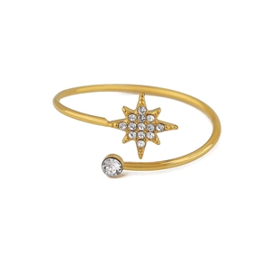 Detail of 18K gold plated open bangle featuring a sparkling star and round crystal