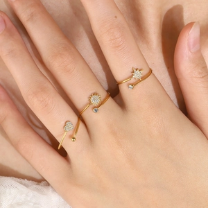 Set of three 18K gold plated open rings featuring heart, sun, and star charms with zircons