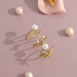 Three-piece 18K gold plated ring set with pearls and crystals in heart and flower designs