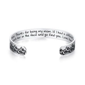 Polished silver stainless steel bangle with wavy engraving and engraved message for mom