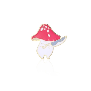 Macro shot of cartoon mushroom enamel pin with knife and polished gold alloy edges