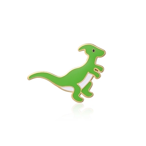 Close-up of a green dinosaur enamel pin with gold plating and polished finish