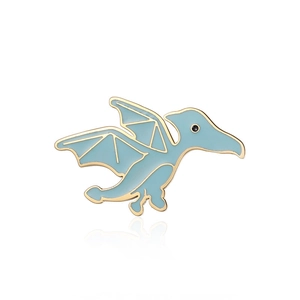 Close-up of a light blue enamel pterodactyl dinosaur brooch with gold metallic outlines