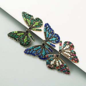 Vintage butterfly stud earrings with colorful rhinestones in green, blue, and multi-color