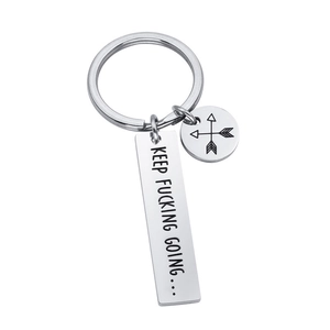 Polished stainless steel keychain with Keep Fucking Going engraving and arrow charm detail