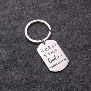 Polished silver metal keychain with Thank you for being the Dad you didn't have to be engraving