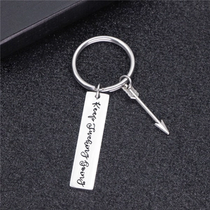Polished stainless steel bar keychain with Keep Fucking Going engraving and arrow charm