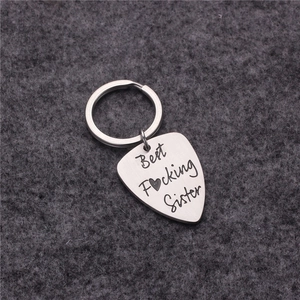 Brushed stainless steel guitar pick keychain with Best Fucking Sister engraving