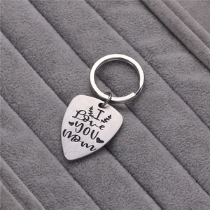 Engraved I Love You Mom guitar pick keychain in brushed stainless steel on grey velvet