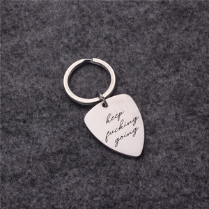 Polished stainless steel guitar pick keychain engraved with keep fucking going text