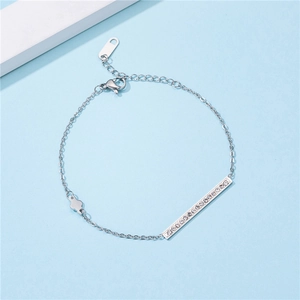 Women's silver stainless steel thin chain bracelet with paved bar and clover charm