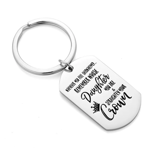 Silver stainless steel dog tag keychain with engraved crown and motivational message
