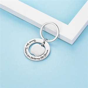 Silver stainless steel apple teacher keychain with Thank You Teacher for Helping Me Bloom text
