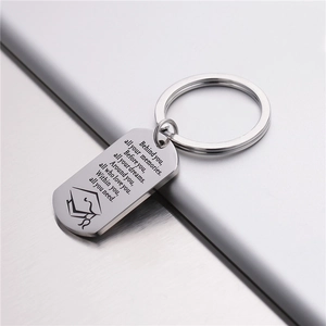 Polished stainless steel graduation keychain with inspirational quote and mortarboard icon