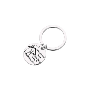 Silver stainless steel keychain with New Home New Adventure engraving and house icon