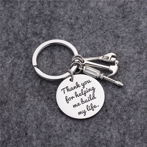 Stainless steel tool keychain with wrench, hammer, screwdriver and engraved round pendant
