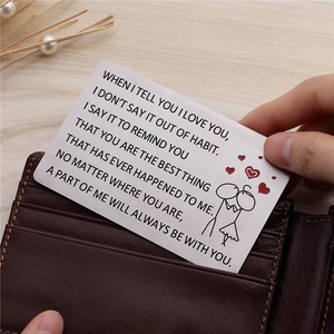 Polished titanium steel wallet card with love quote engraving in a leather wallet