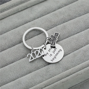Titanium steel graduation keychain with graduation cap and my story is just beginning charm