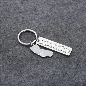 Titanium steel keychain with I love you more than the miles between us engraved tag