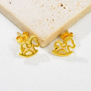 Minimalist 18K gold rocking horse stud earrings with hollow design on stone stand