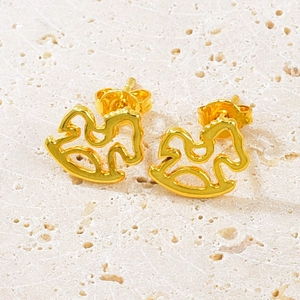 Macro shot of gold rocking horse earrings with minimalist hollow-out design and polished finish