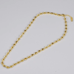 Detail of 18K gold plated coffee bean link necklace with K18 engraved tag and lobster clasp