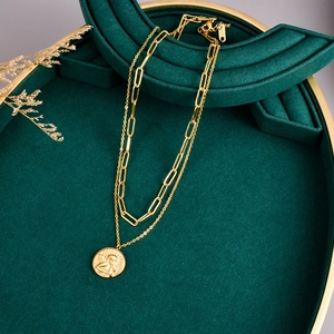 Double-layered 18k gold stainless steel choker featuring an angel coin pendant and paperclip chain