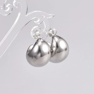 Polished silver teardrop earrings in a chunky minimalist design for a modern look