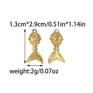 Macro view of gold mermaid tail pendant with 1.3cm x 2.9cm size and 2g weight details