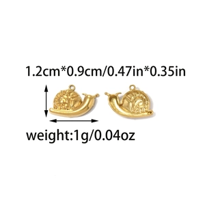 Detailed view of snail heart pendants in 18K gold plated steel with dimensions 1.2cm x 0.9cm