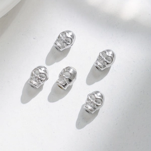 Five pieces of 18K gold plated stainless steel skull beads for DIY jewelry making