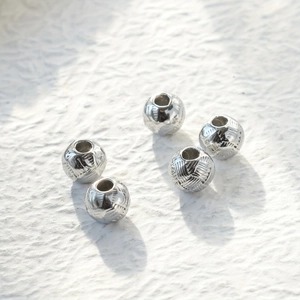 Silver woven texture stainless steel beads for jewelry making on white background