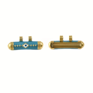 Détails du pendentif œil émaillé bleu avec bords dorés et structure creuse au dos