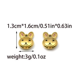 Golden 18K stainless steel rabbit pendants with pink enamel details and hanging loops