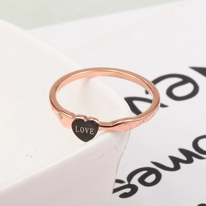 Elegant rose gold titanium ring with a black heart charm and tiny sparkling zircon