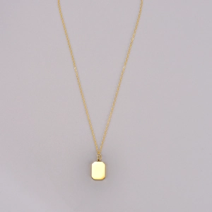 Minimalist gold necklace with a polished rectangular pendant and fine link chain
