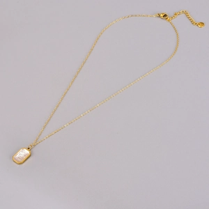 Elegant gold necklace featuring a rectangular shell pendant with Time flies engraving