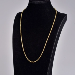 Elegant gold-tone dainty pearl choker necklace displayed on a professional black bust